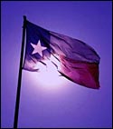 Image of Texas flag backlit by sunlight